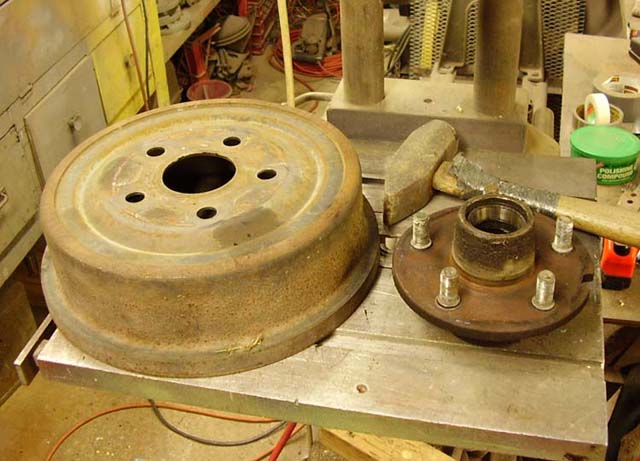 Press the hub assembly from the brake drum.